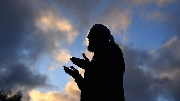 Mufti Zeeyad Ravat leads a prayer at a makeshift memorial at the Al Noor Mosque in Christchurch.