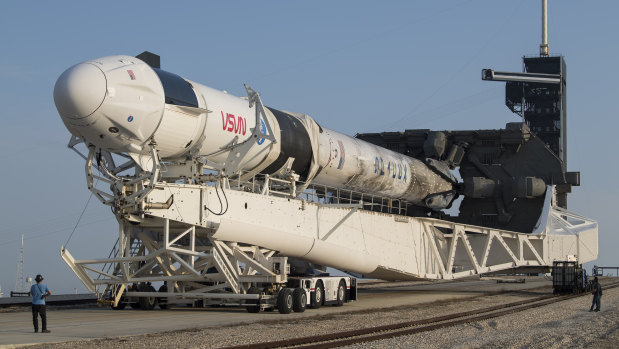 The SpaceX Falcon 9 rocket with the company’s Crew Dragon spacecraft is rolled to Launch Complex before take off. 