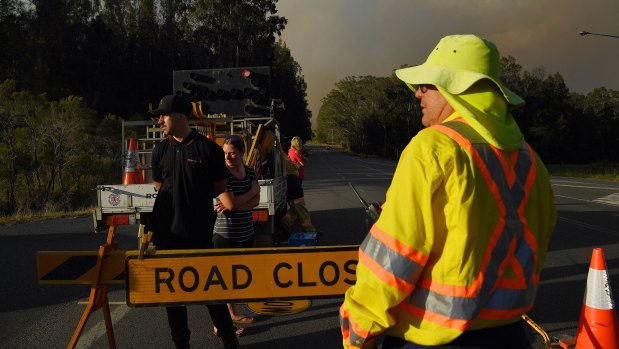 The bushfires have forced emergency services to close the road at the intersection of The Lakes Way and Blackhead Road, north of Forster-Tuncurry.