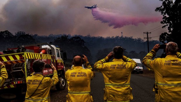 NSW's large aerial tanker, a 737 jet, dumps fire retardant on a bushfire south of Port Macquarie in October 2019. 