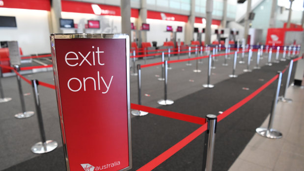 An empty Virgin Australia check-in area at Brisbane domestic airport.
