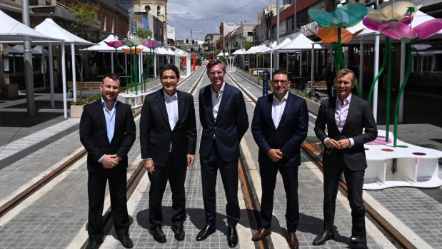 Premier Dominic Perrottet with local MP Geoff Lee and Cities Minister Rob Stokes at the Parramatta light rail in late 2021.