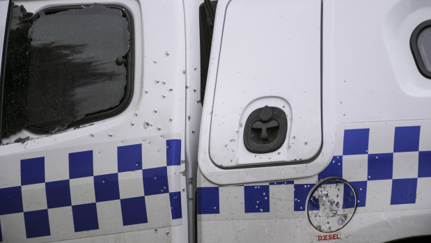 A police patrol car was shot at and rammed outside a McDonald's restaurant in Sunbury.