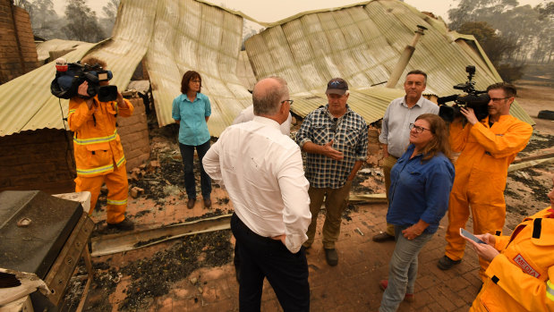 Prime Minister Scott Morrison tours a farm in fire-ravaged Sarsfield, Victoria.