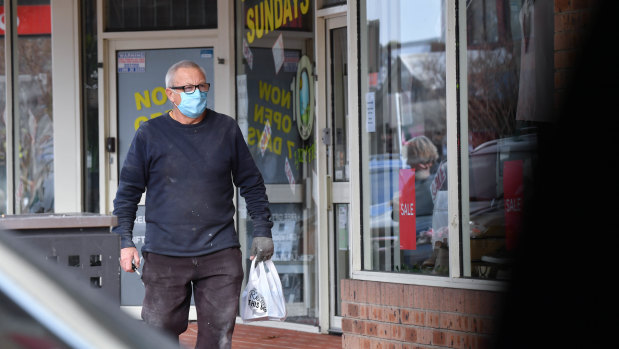 A man in Pakenham wearing a face mask on Friday.