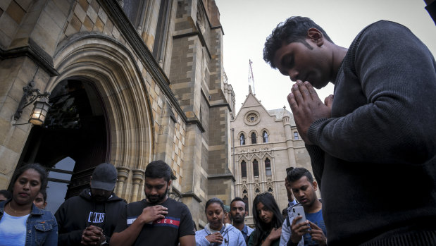 Members of Melbourne's Sri Lankan community outside St Paul's Cathedral. 