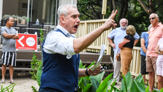 Auctioneer Tom Panos at a three-bedroom property in Lane Cove that on Saturday sold for $500,000 above the reserve.