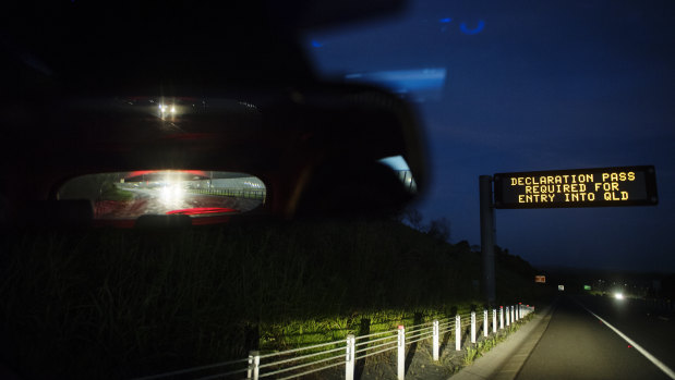 Signs on the Pacific Highway informing drivers to have their border passes before crossing the NSW-Queensland border.