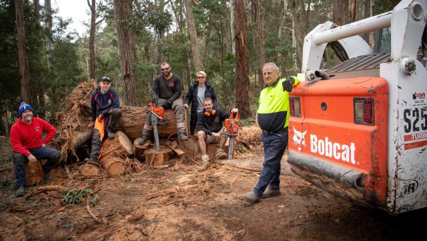 Woodend locals cleaning up in Garner Quadrant after the storm. 