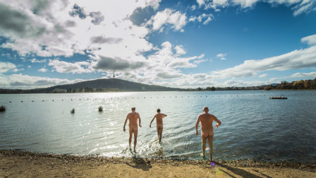 Swimmers, from left, Peter Linderman, Dave Hay and Ian Lindeman prepare for the Winter Solstice Nude Swim.