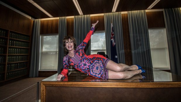 Author Kathy Lette in the prime minister's suit at Old Parliament House on Friday as they leadership ballot played out up on the hill. "I don't want to flash a fallopian tube.''