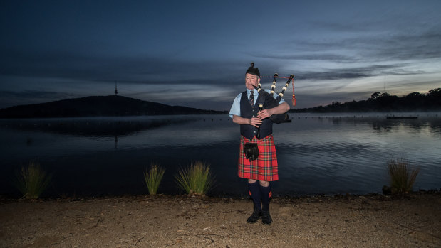 The sound of bagpipes serenaded swimmers as they plunged nude into Lake Burley Griffin for a charity dip on Thursday morning.