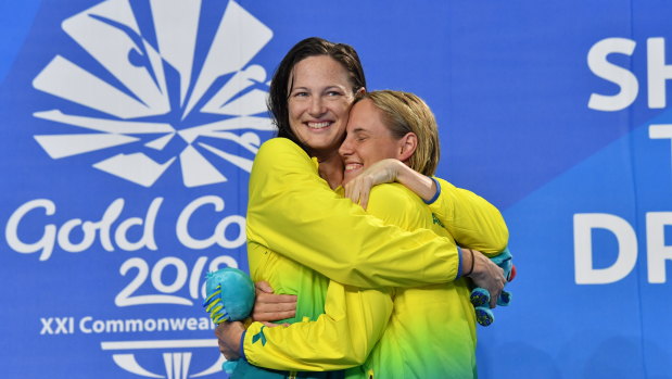 Sibling rivalry: Cate Campbell (left) hugs Bronte during the Commonwealth Games on the Gold Coast.