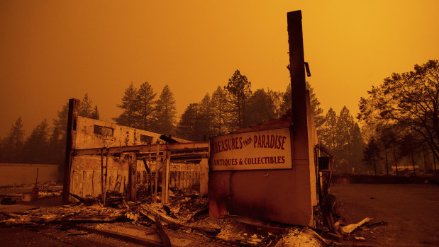 The walls of a scorched antique shop stand on Skyway after a wildfire burned through Paradise, California.