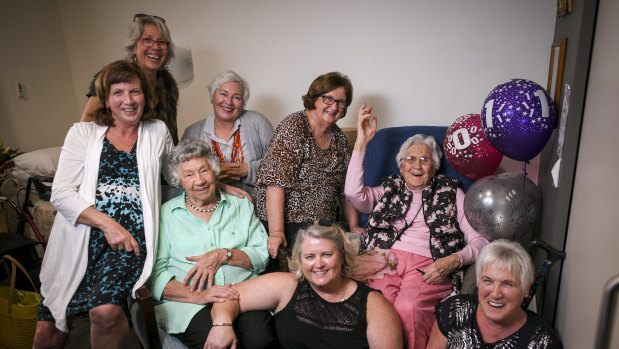 Living it up: Nessie Kluckhenn (waving) and her family enjoy her 110th birthday party.