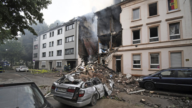 A car and a house are destroyed after an explosion in Wuppertal, Germany.