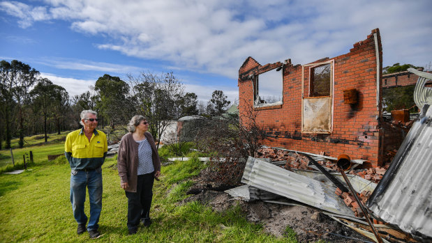 Lyn and Allan Wallwork are living in their shed while waiting for the removal of their destroyed Sarsfield home.