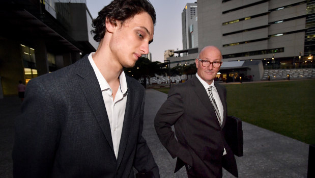 Lachlan (left) and David Pirie leave the District Court in Brisbane on Friday.