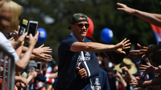 Hero's reception: Cooper Cronk greets Roosters fans at Allianz Stadium on Monday.