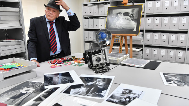 Legendary Age photographer Bruce Postle with photographs and other memorabilia.