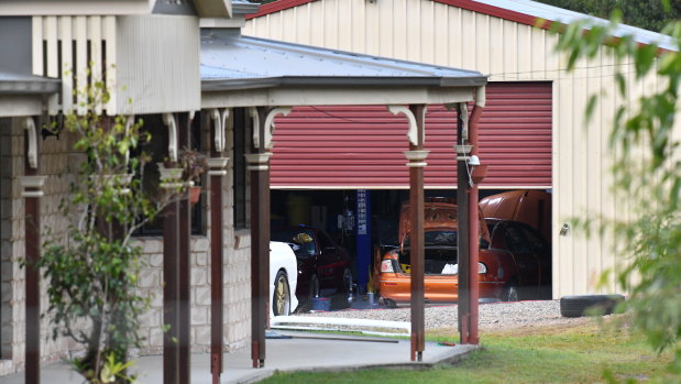 A shed is seen behind a house in the suburb of Buccan, south of Brisbane, where the body was found.