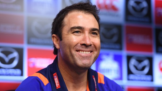Winning grin: Coach Brad Scott after the Roos' fighting win over Hawks.