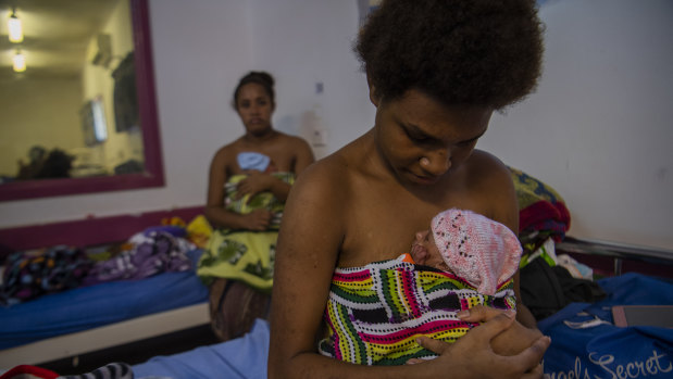 Young mothers Sula Savya (at front), 16, and Lamancha dKalau, 20, with their babies. 