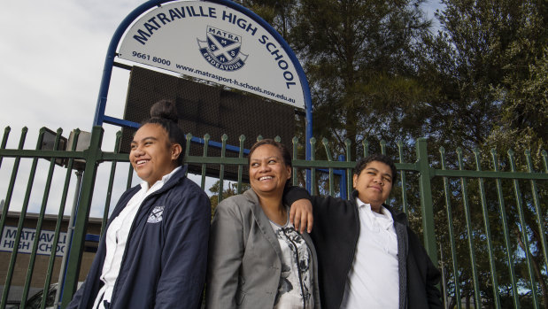 Maria Kaivananga with her daughter Faith and son Genesis outside Matraville Sports High School.