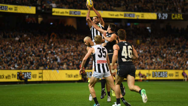 Brodie Grundy flies high for the Magpies.