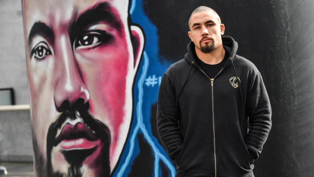 Robert Whittaker, the man and the mural, at Marvel Stadium.
