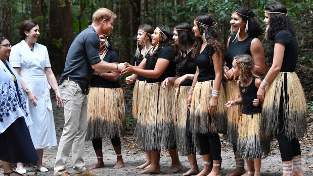 Prince Harry meets members of the Butchulla people during the unveiling of the Queen's Commonwealth Canopy plaque.