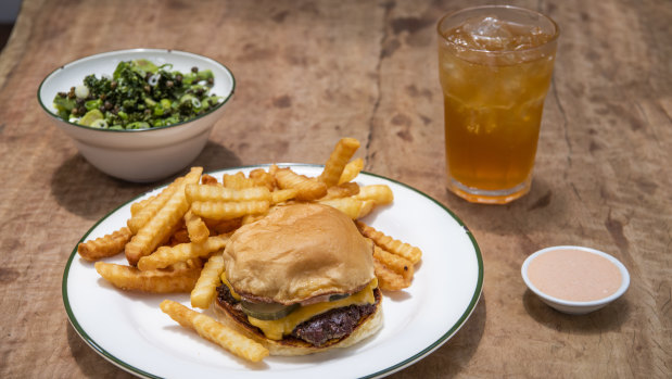Bush's cheeseburger, with chips and a bowl of greens, has turned into a social media sensation. 