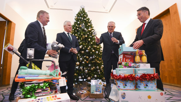Opposition leader Anthony Albanese,  Deputy Prime Minister Michael McCormack, Prime Minister Scott Morrison and deputy Opposition leader Richard Marles deliver presents at the Kmart Wishing tree launch at Parliament House in early December.