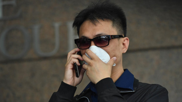 A former dealer at Crown, Michael Hou, has been charged over an alleged card con at the casino.