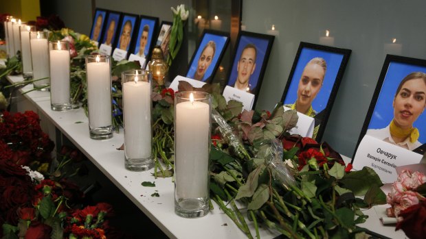 Tribute in Kyiv: Flowers and candles are placed in front of portraits of the flight crew members of the Ukrainian 737-800 plane that crashed on the outskirts of Tehran on Wednesday.