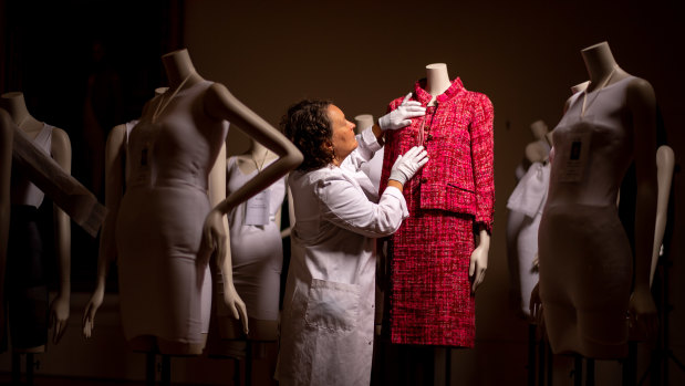 Ellen Doyle, textile display specialist, prepares a pink suit (Spring 1966) from the NGV’s own collection for the upcoming exhibition, Gabrielle Chanel. Fashion Manifesto.
