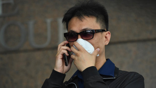 A former dealer at Crown, Michael Hou, has been charged over an alleged card con at the casino.