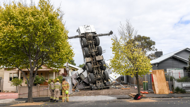 MFB crews are on scene to try and stand the crane back up. 
