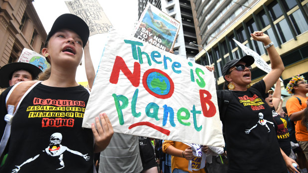 School students take part in the climate change strike in Brisbane.