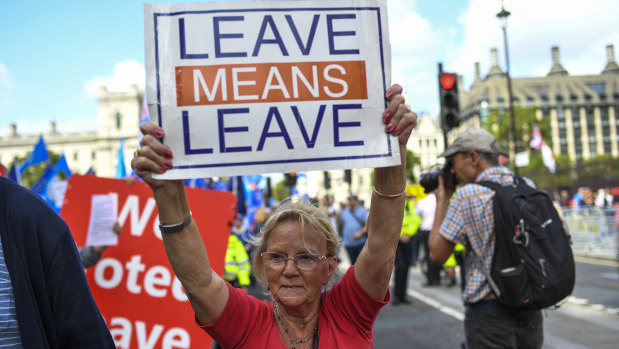 Pro-Brexit demonstrators gather and march at Parliament Square in London on Tuesday.