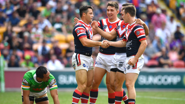 Cooper Cronk and the Roosters celebrate during their  Magic Round clash in Brisbane.