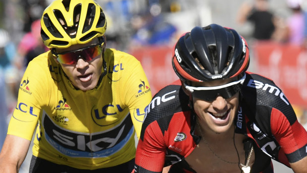 Richie Porte rides ahead of former teammate Chris Froome.