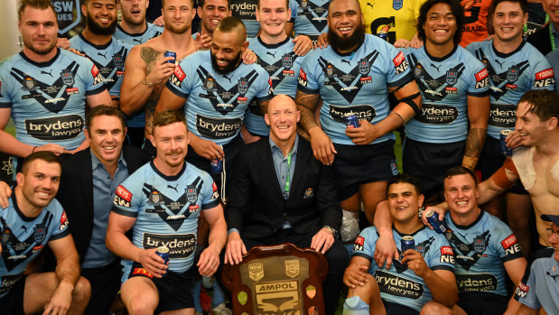 Craig Fitzgibbon celebrates an Origin series win one last time with the players.