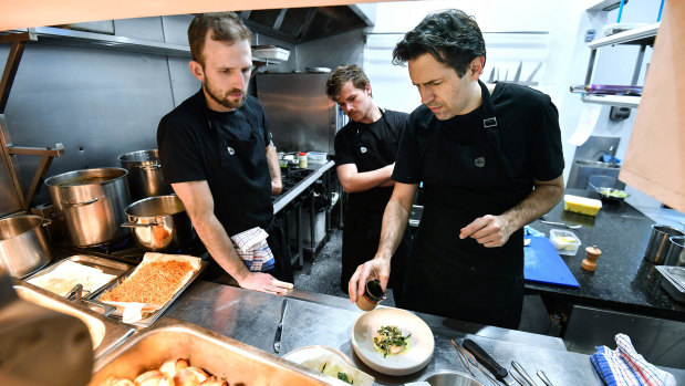 Ben Shewry, right, working on new recipes in the kitchen at Attica.