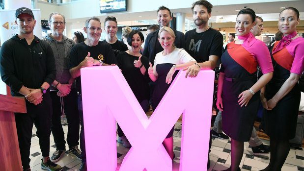 Queensland Innovation Minister Kate Jones (centre) poses for a photo with entrepreneurs and thinkers including Steve Baxter (third left) and former CIA analyst Yael Eisenstat (fifth left), on arrival for the 2018 Myriad Festival in Brisbane.