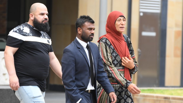 Relatives of Belal Berka with their solicitor (centre) outside Parramatta Supreme Court on Monday, December 16, 2019.