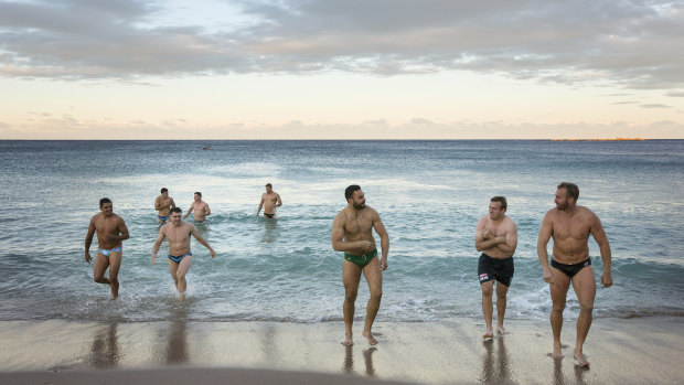 Blues hit beach: NSW players take a dip at Coogee on Sunday.