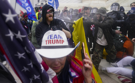 Trump supporters trying to break through a police barrier at the Capitol on January 6.