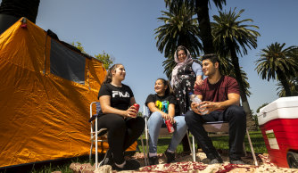 Chilling out in the sun: Ahmad Ahuonbar with sisters Shipal and Kalin and mother Zahra staked out a spot in the Alexandra Gardens, well ahead of the midnight fireworks.