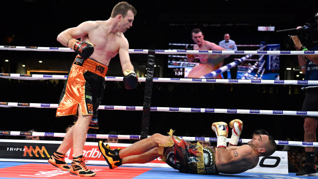 Next generation: Jeff Horn stands over Anthony Mundine as he hits the canvas.